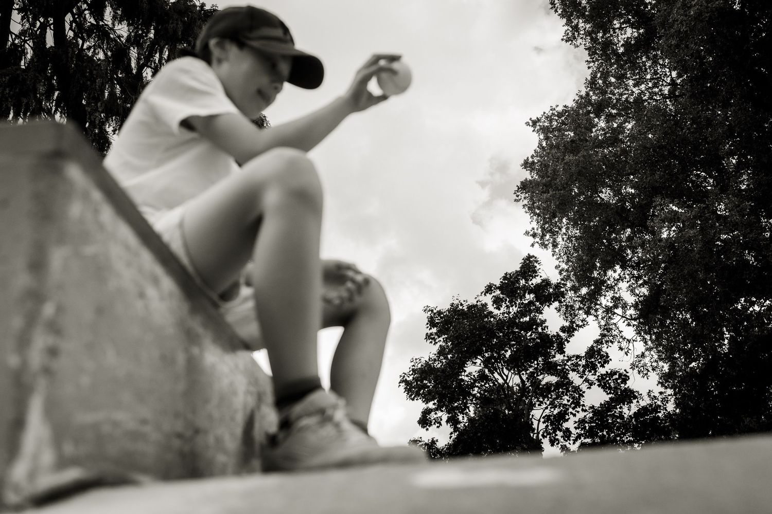 A boy playing with tennis ball at Friary Park.