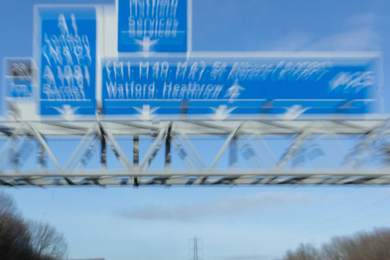 International camera movement of a blue sign on the motorway.