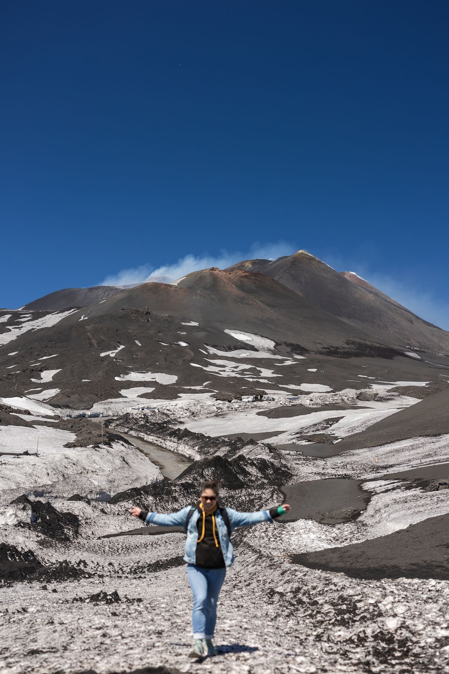 Me running down the hill with Mount Etna in the background.