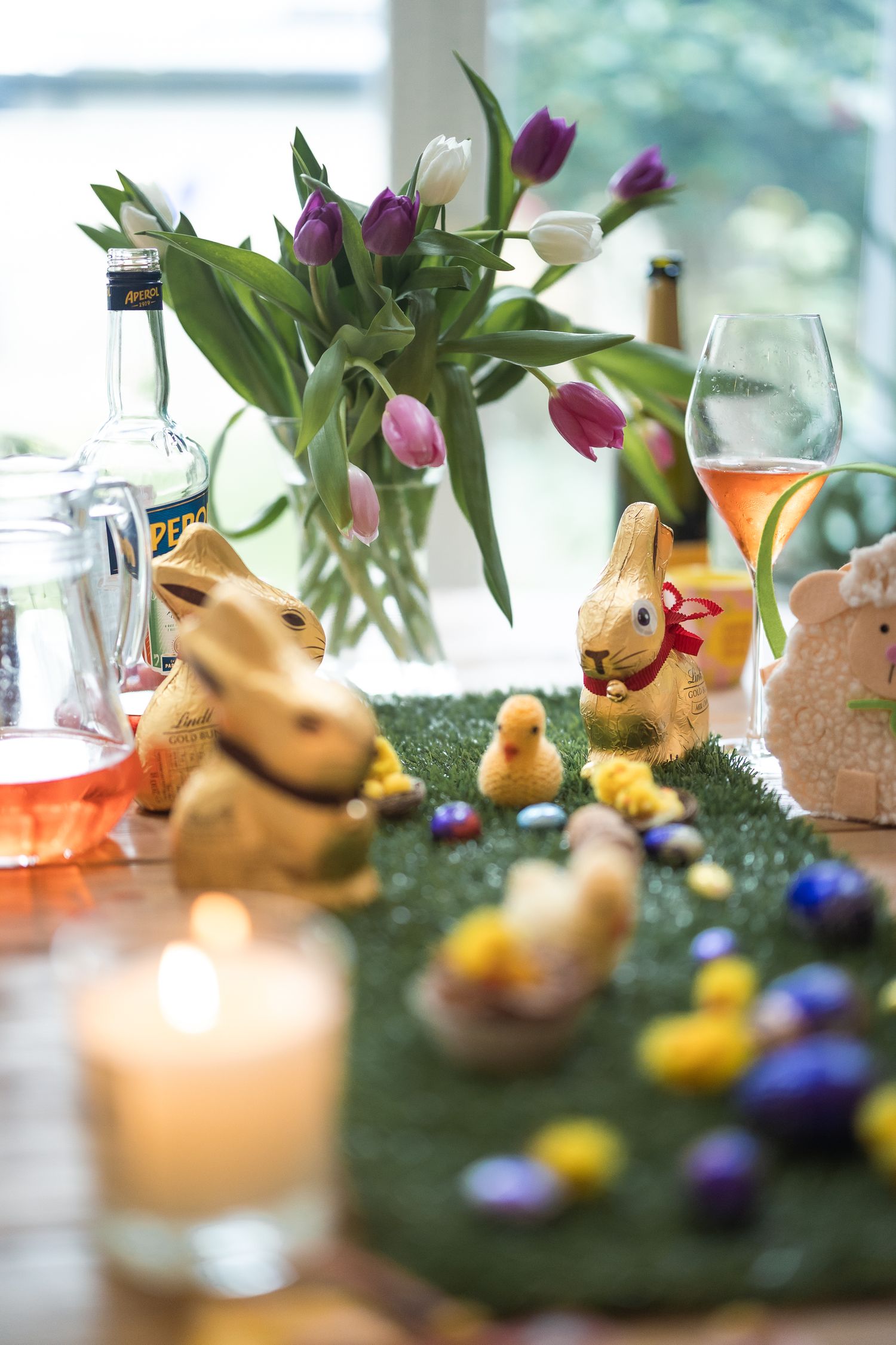 Easter tablescape and scenes, featuring Lindt bunny, tulips and easter eggs.