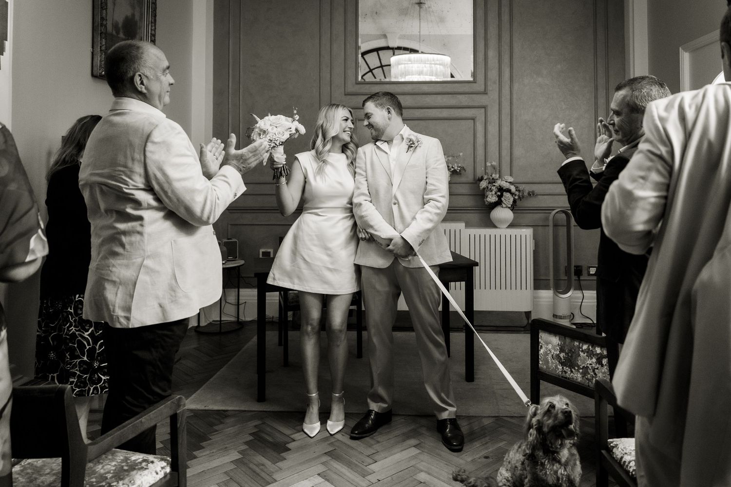 The guests clap the newly weds in the Rosetti Room at Chelsea Old Town Hall.