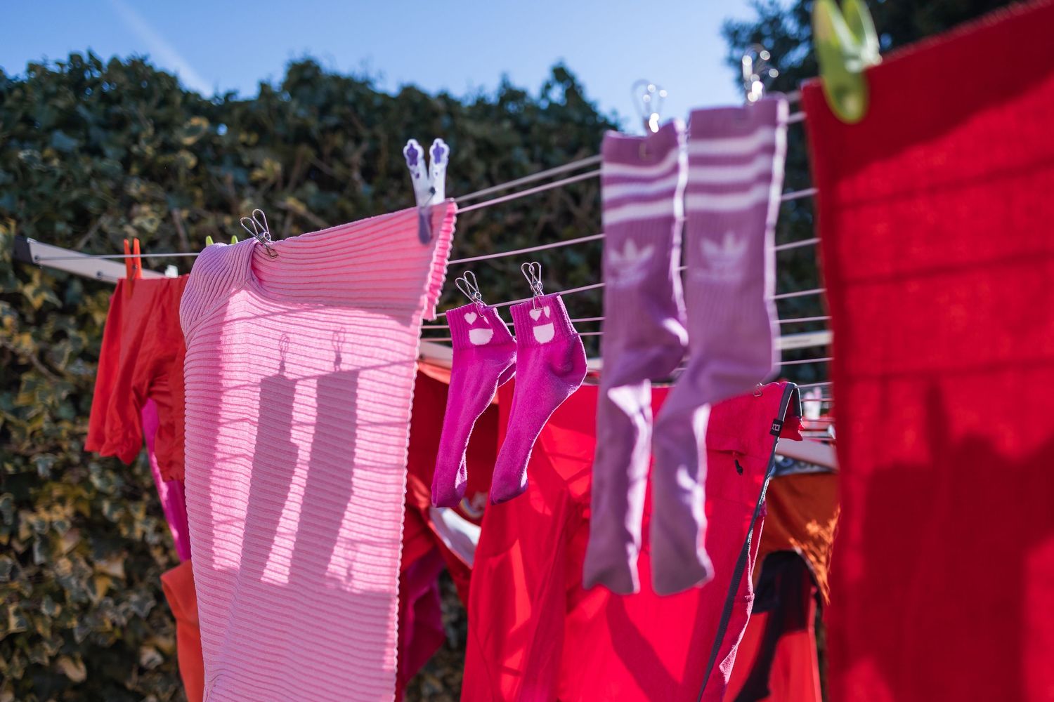 Washing hanging on a line, made interesting by having clothes in the foreground drawing the eye in, and also interesting shadows.