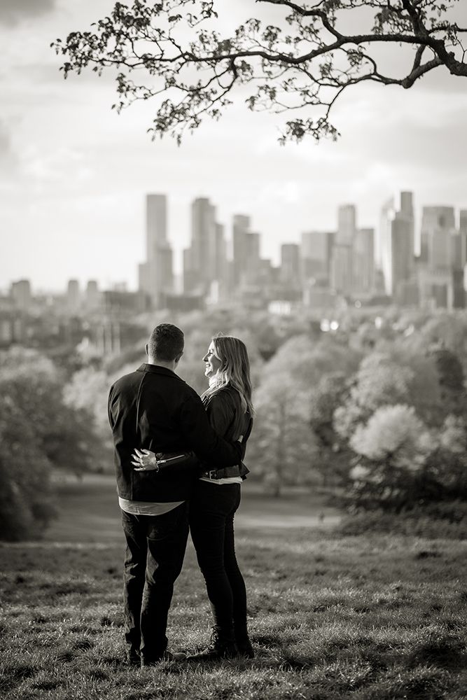 Couple looking out over London on a pre-wedding shoot in Greenwich park.