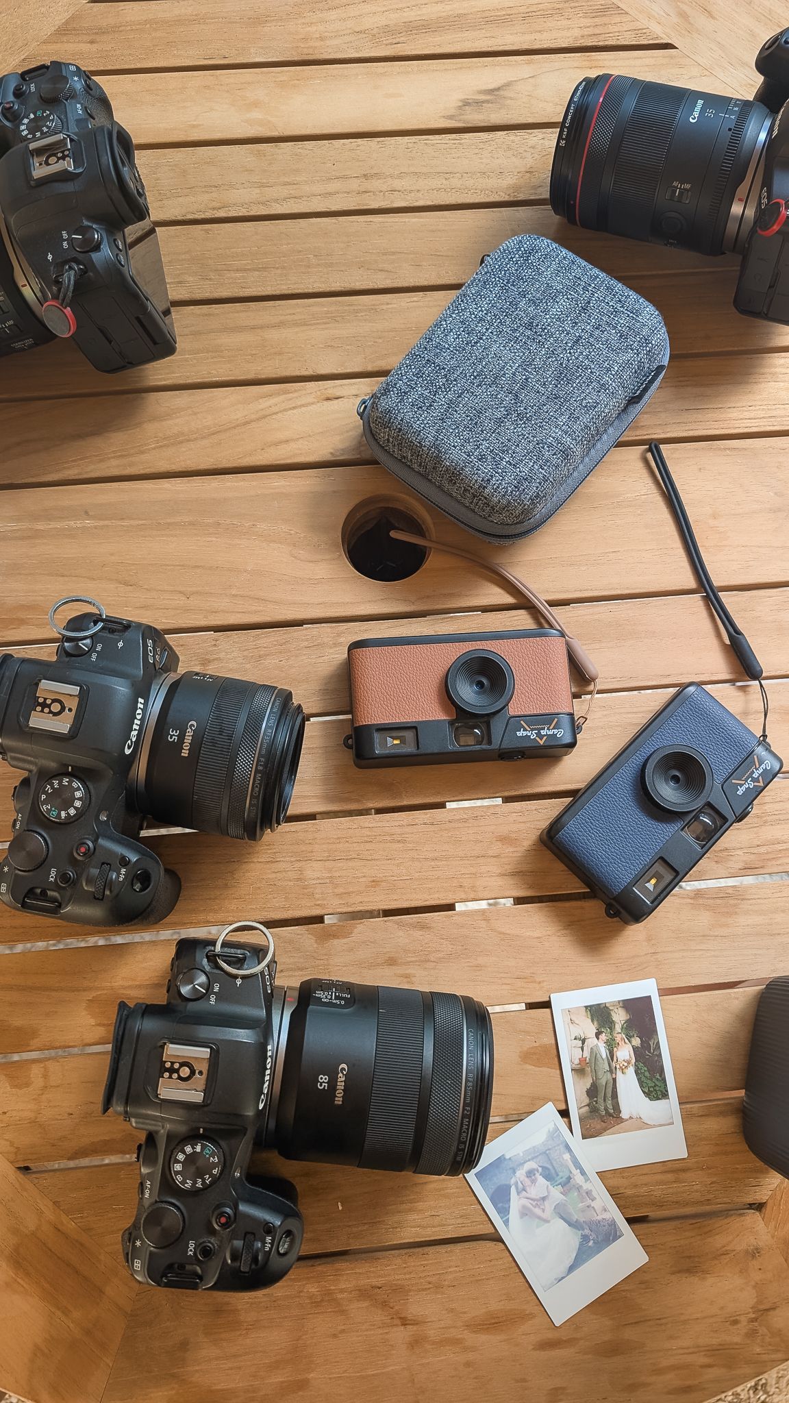Flat lay of all the cameras that a photographer has with them on a wedding day.