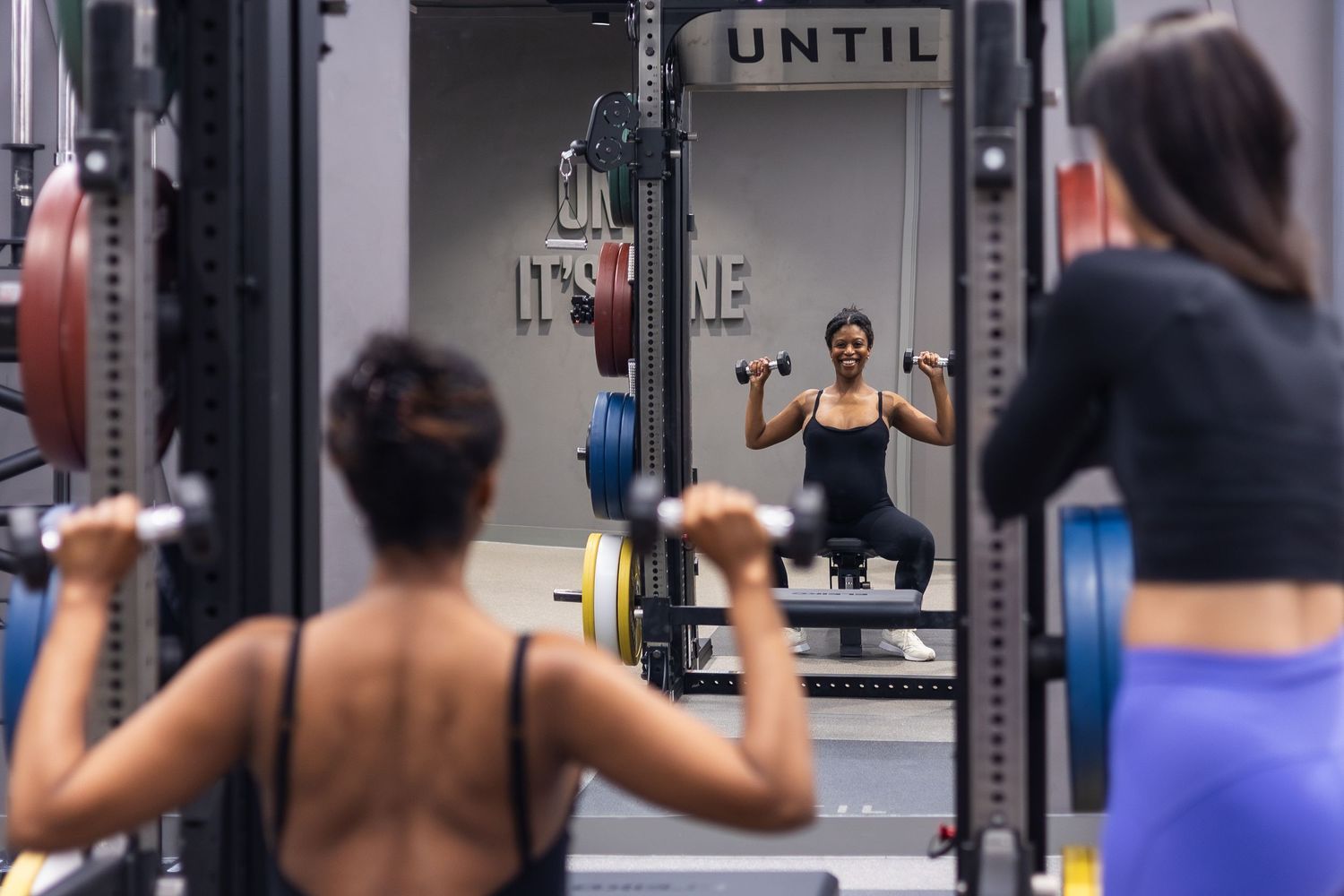 PT business owner interacting with a client in UNTIL gym space in Marylebone London.