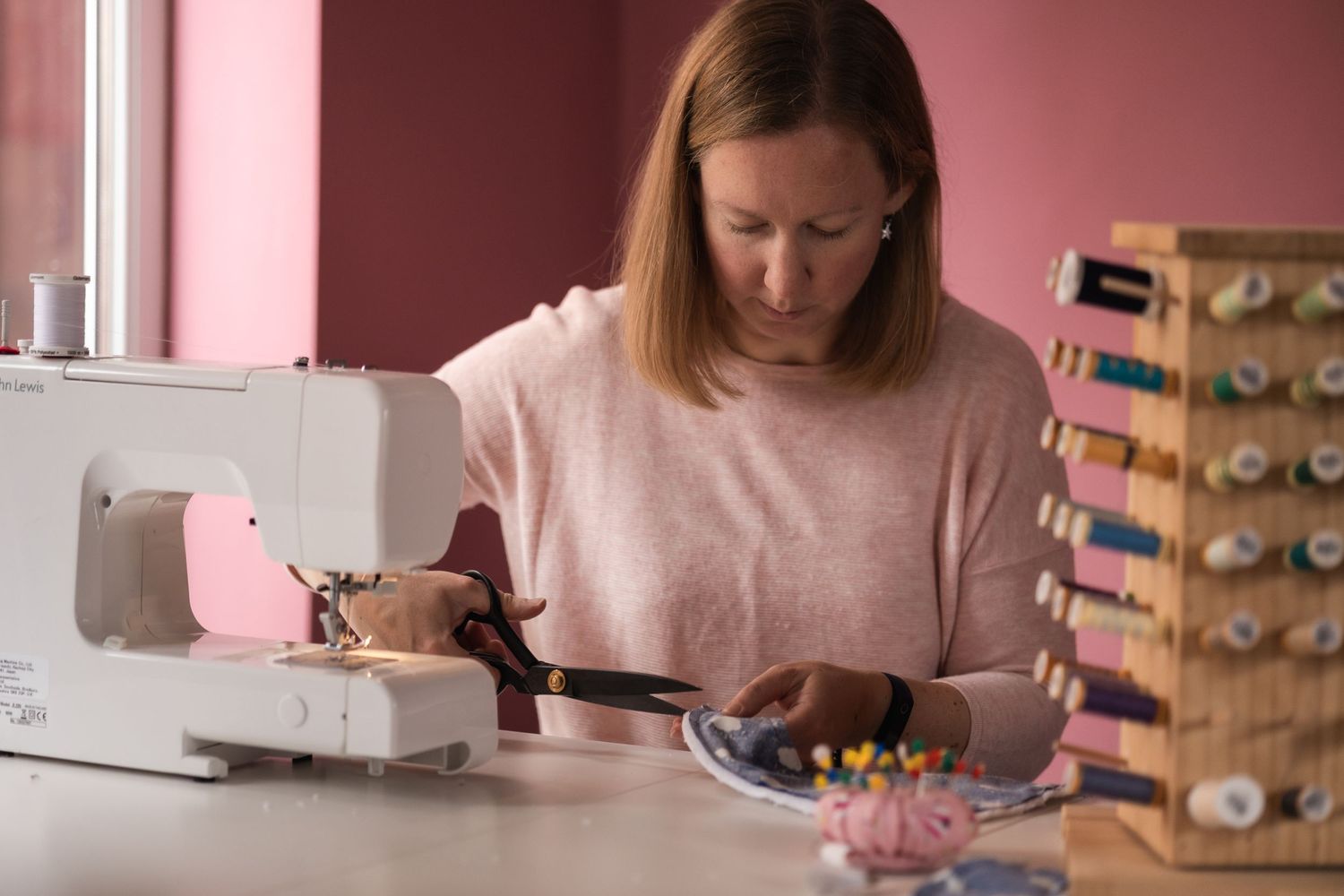 Behind the scenes of small business owner at work, in North London studio.