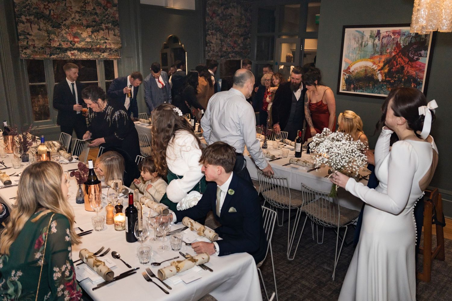 All the guests start to enter the dining area at The Phene, London for the wedding meal.