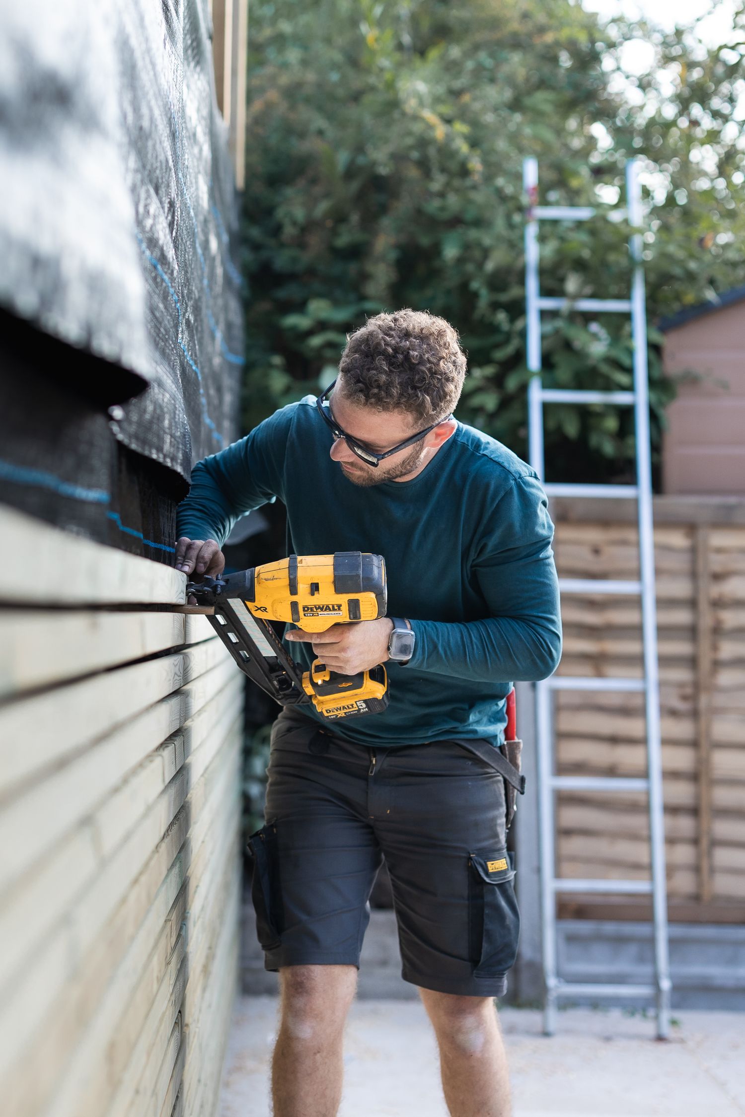 Local Watford based gardener building a fence in new patio area.