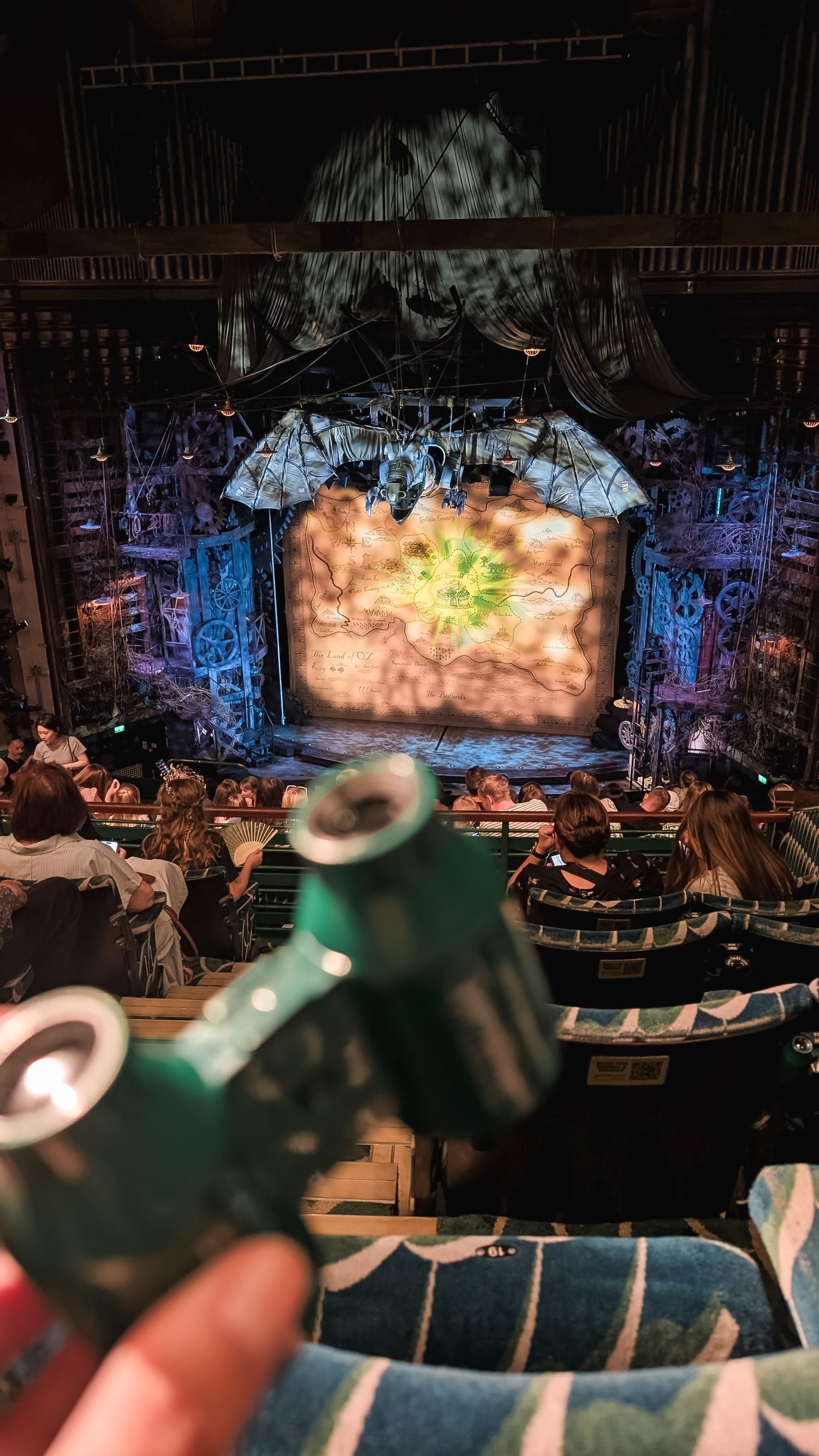 Scene of binoculars in front of Wicked theatre show at the West End.