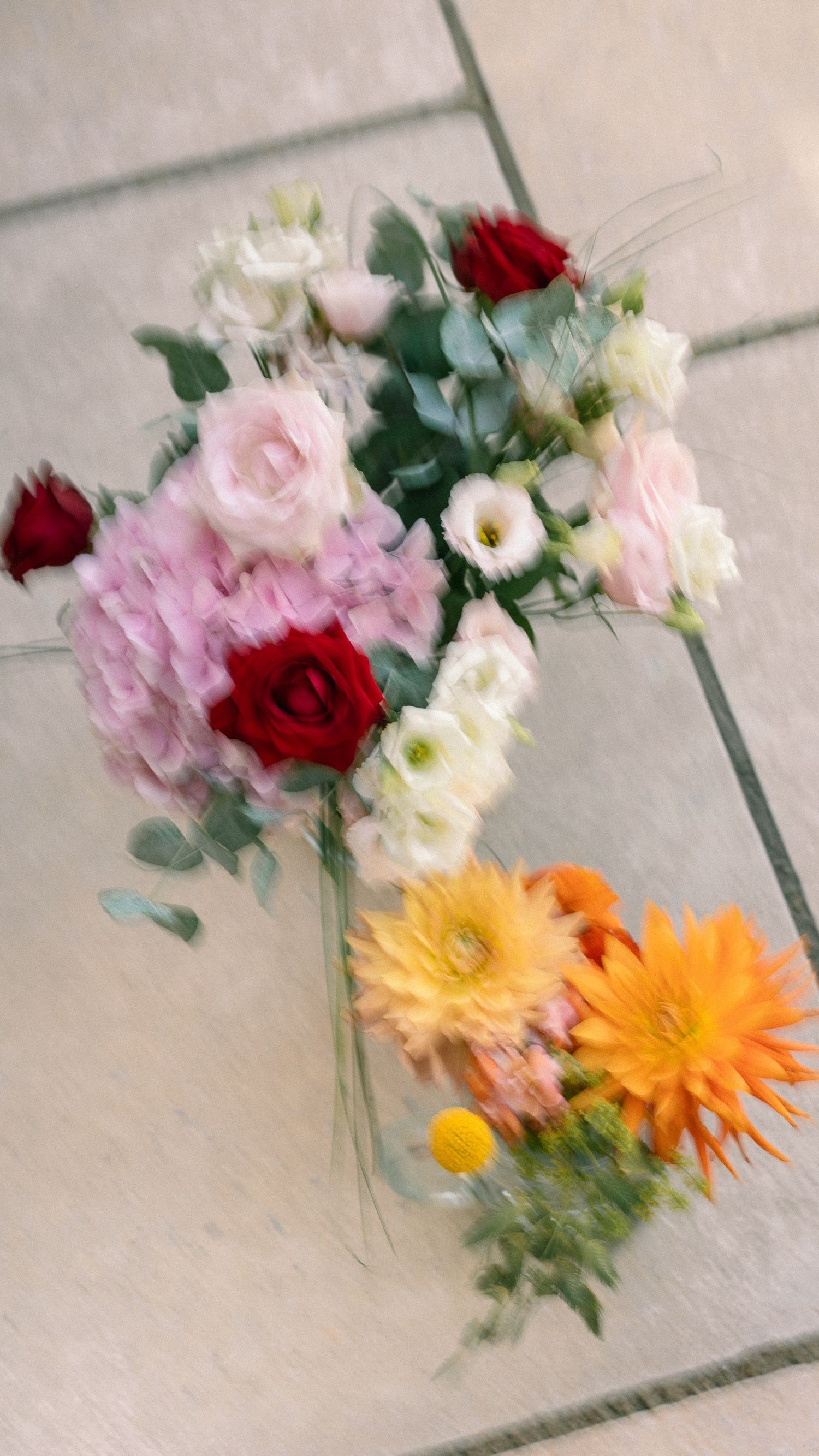 Flat lay (with international camera movement for a whimsical look) of bridal flower bouquet.