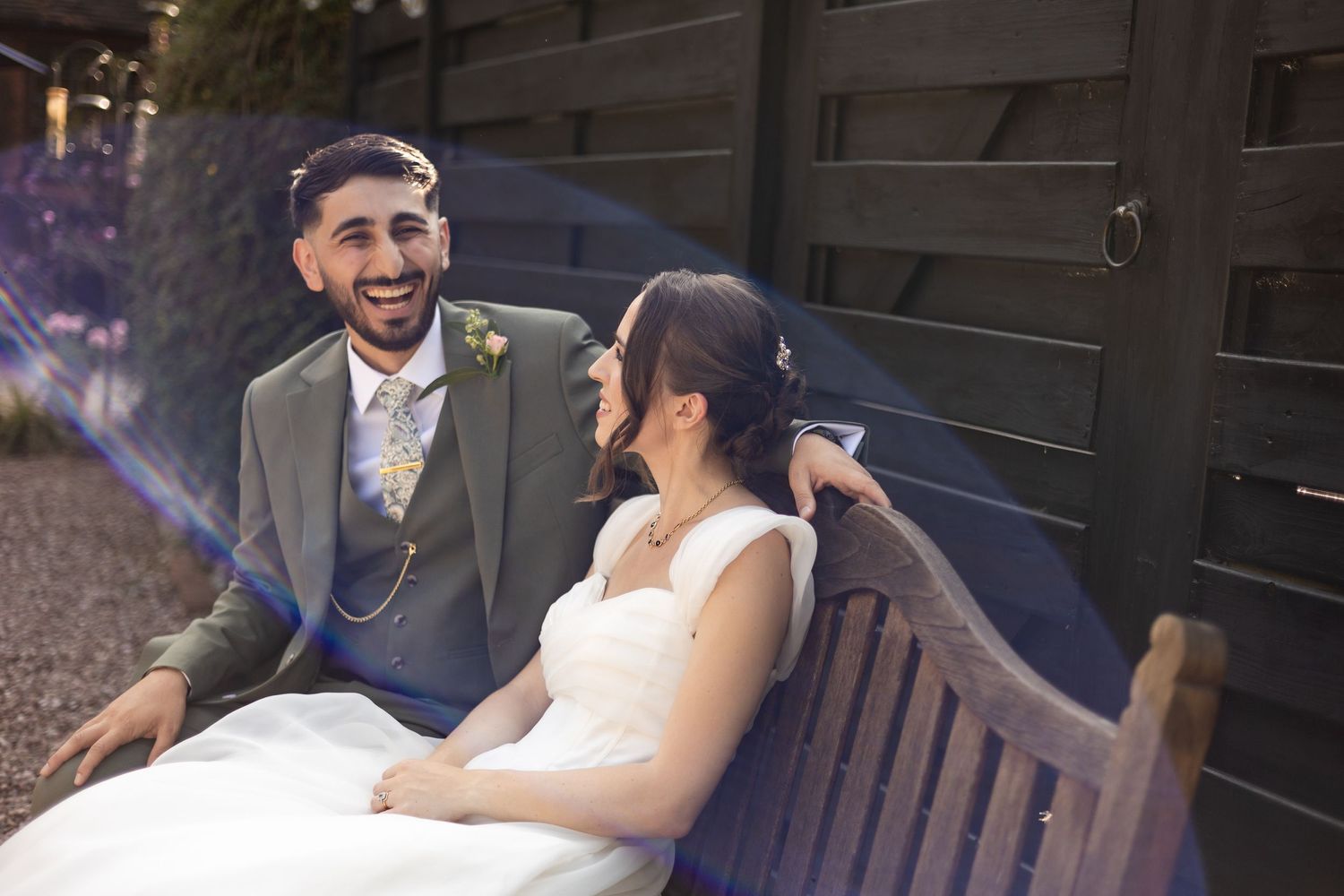 Relaxed couple hanging out together, before they enter for dinner, whilst all the guests are being seated.