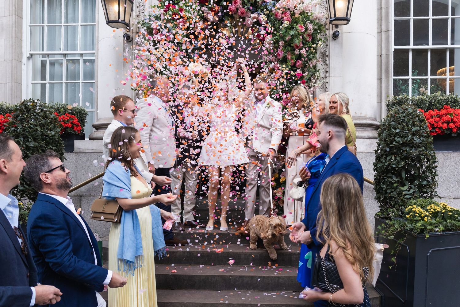 Colourful confetti moment filled with movement and laughter outside Chelsea Old Town Hall on King's Road