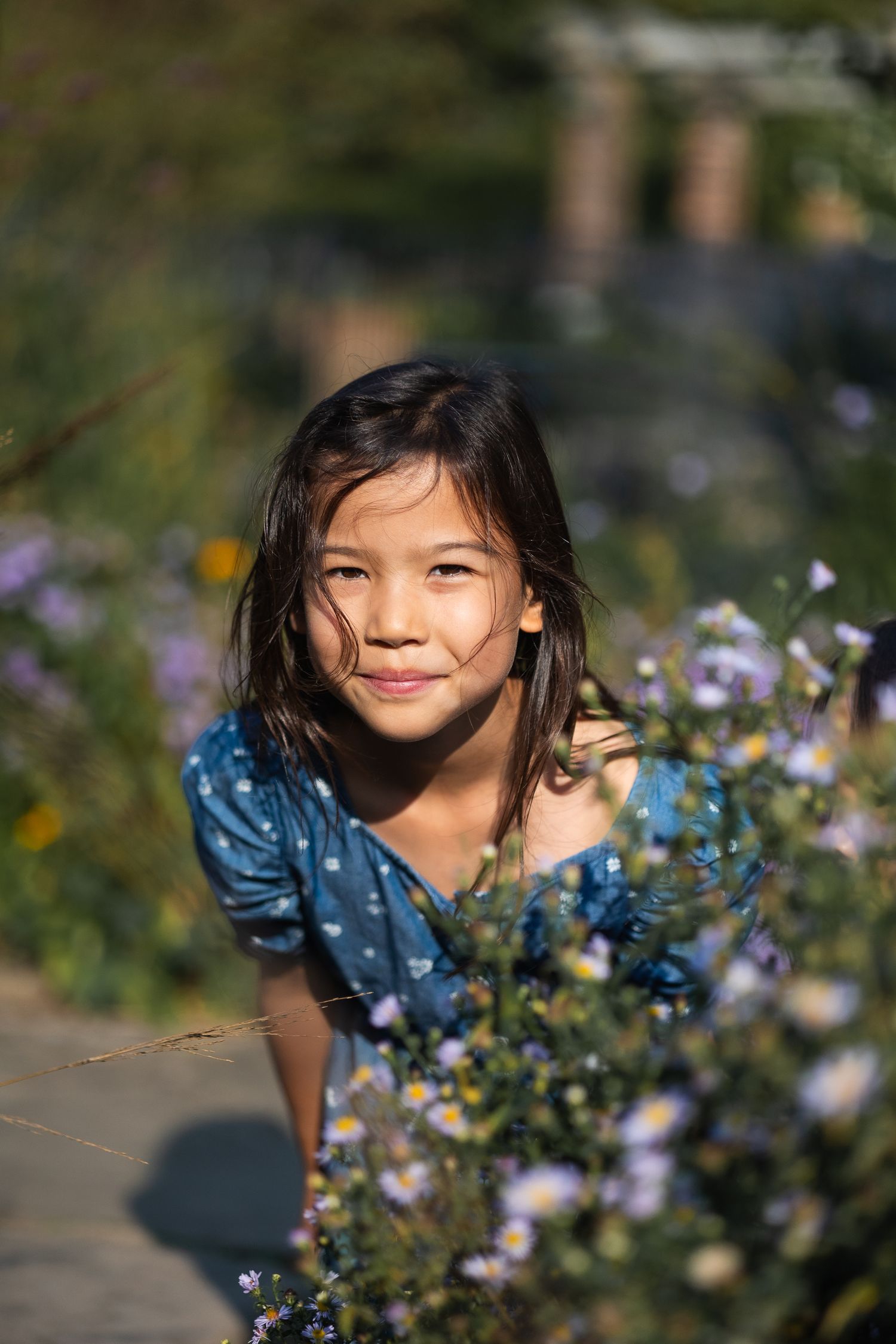 Headshot photo of girl at family photoshoot in Hampstead, London at golden hour.