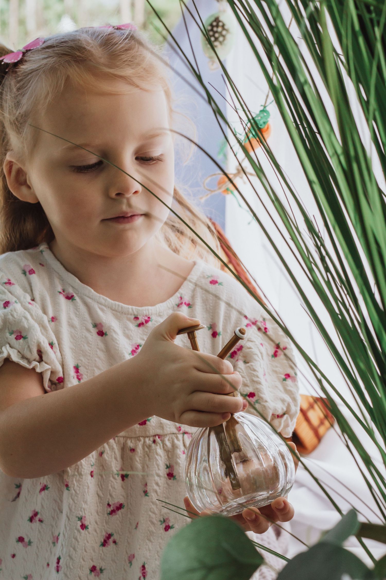 Delicate spring scene with glass decorations and natural elements.