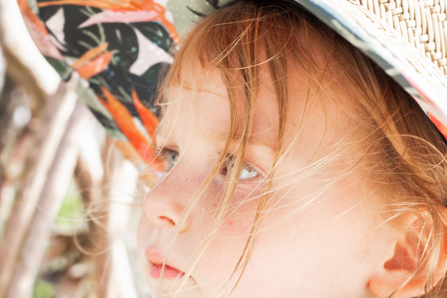 Close-up detail of someone wearing a bright orange accessory.