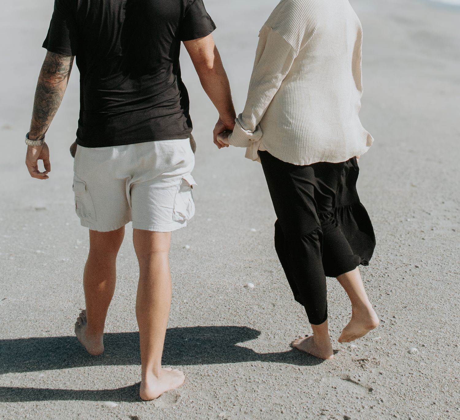A series of photos showing bare feet walking on a sandy beach surface in a progressive sequence.