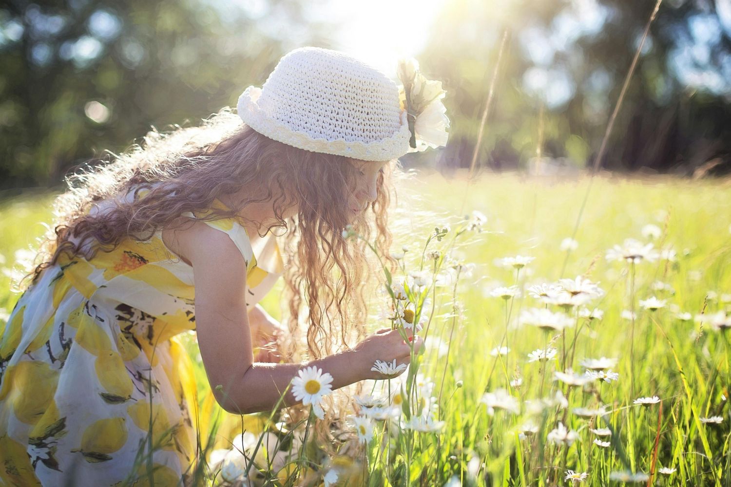 Girl smelling flowers