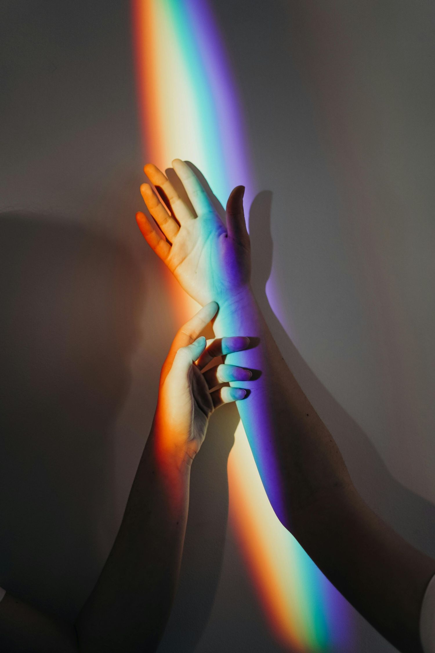 Rainbow prism on hands