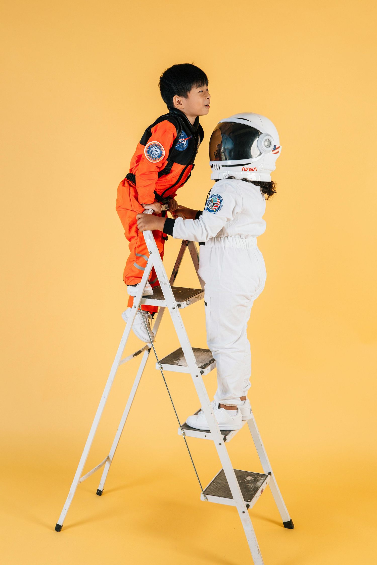 Kids climbing a ladder