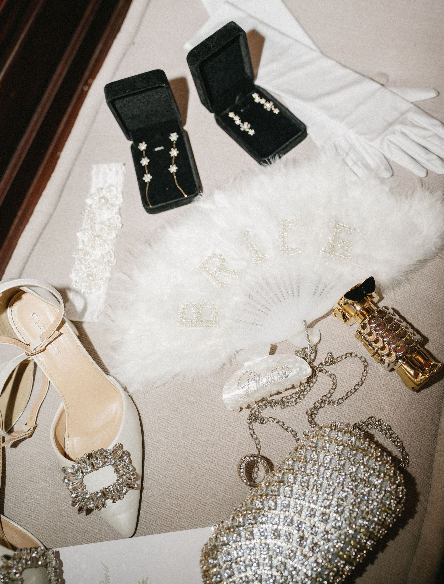 Wedding accessories including jewelry boxes, gloves, shoes and a crystal clutch.