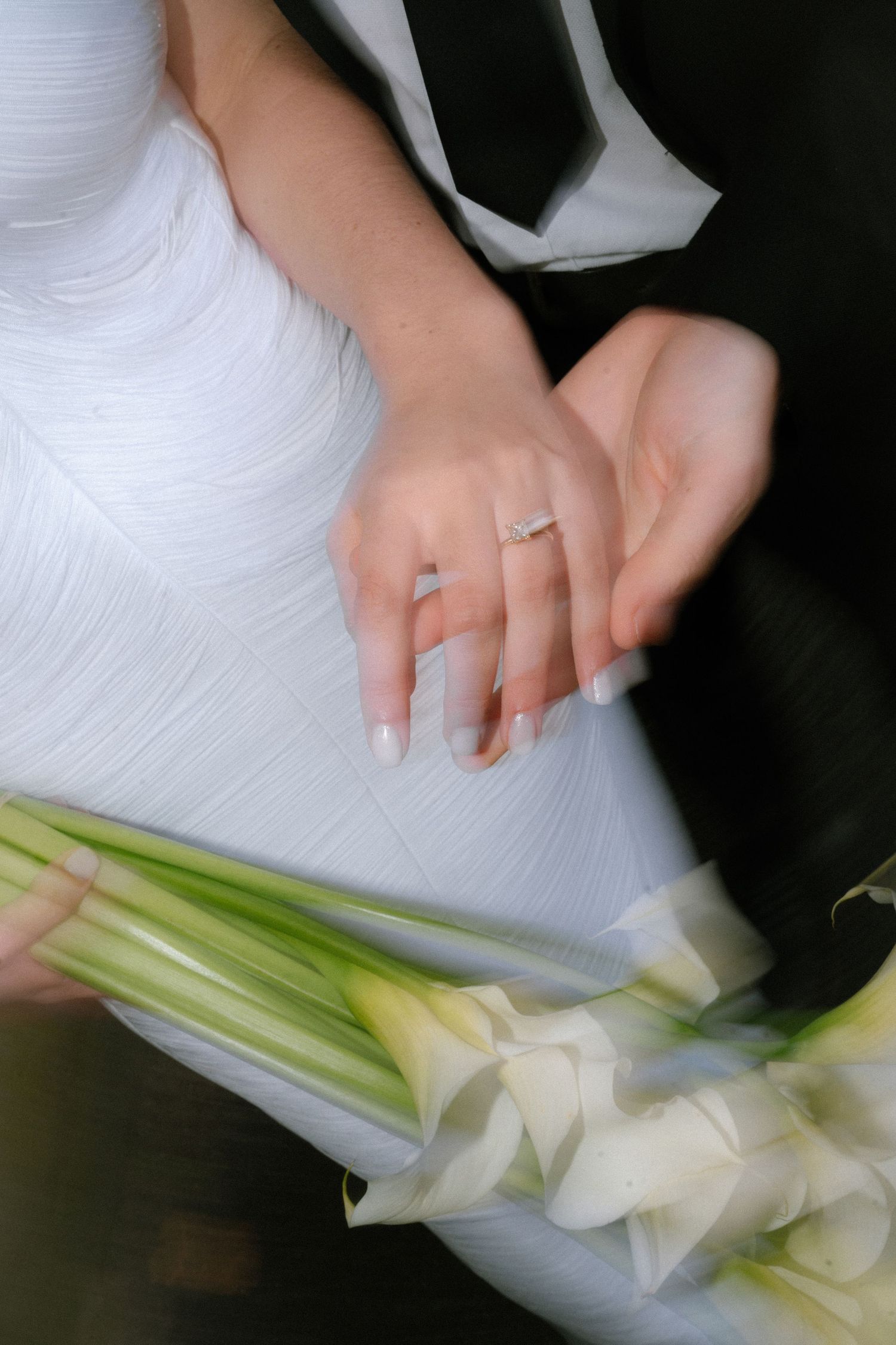 Close-up of hands slicing fresh celery stalks on a white cutting board in sequence.
