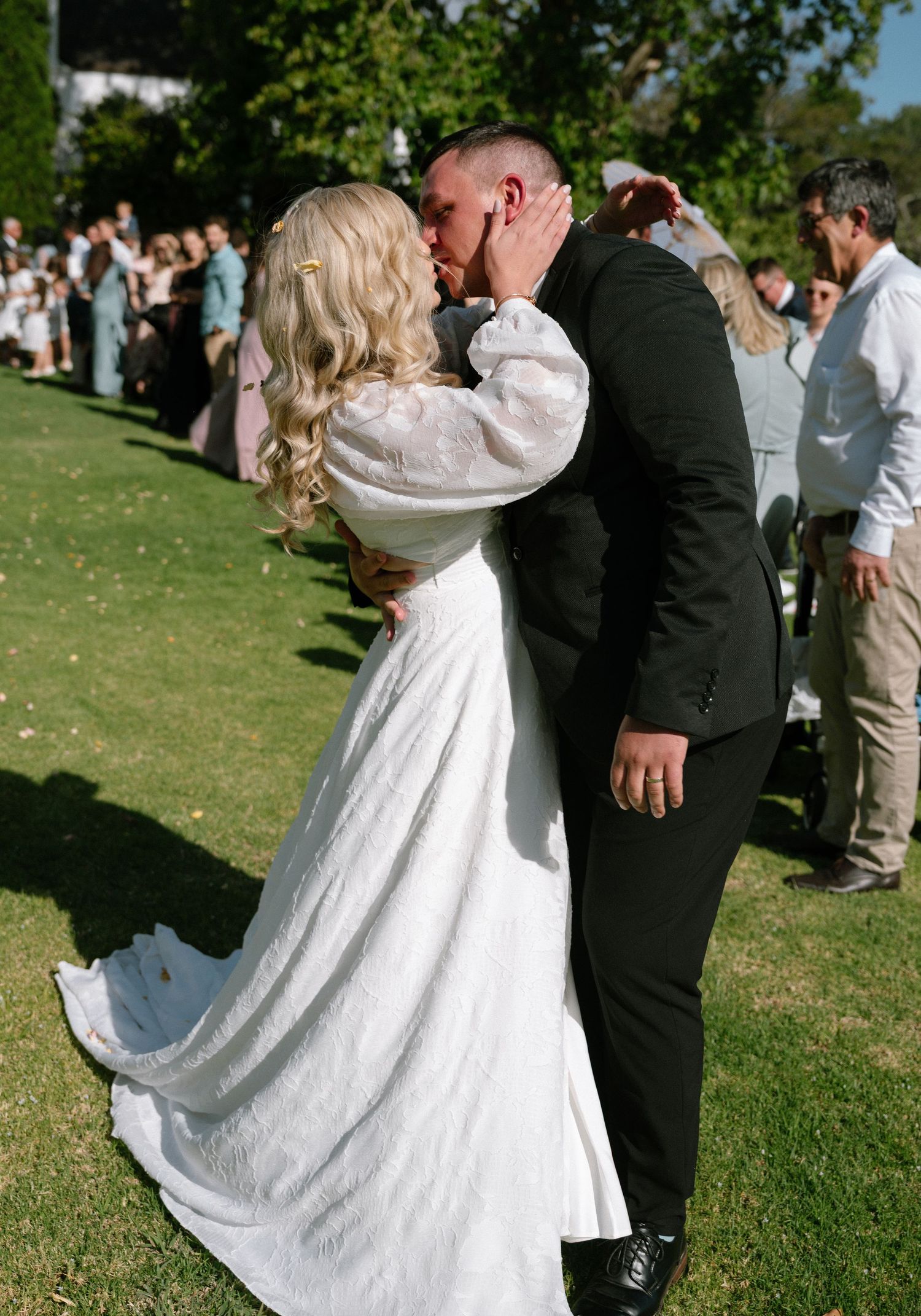 Romantic outdoor wedding moment captured in a garden setting.