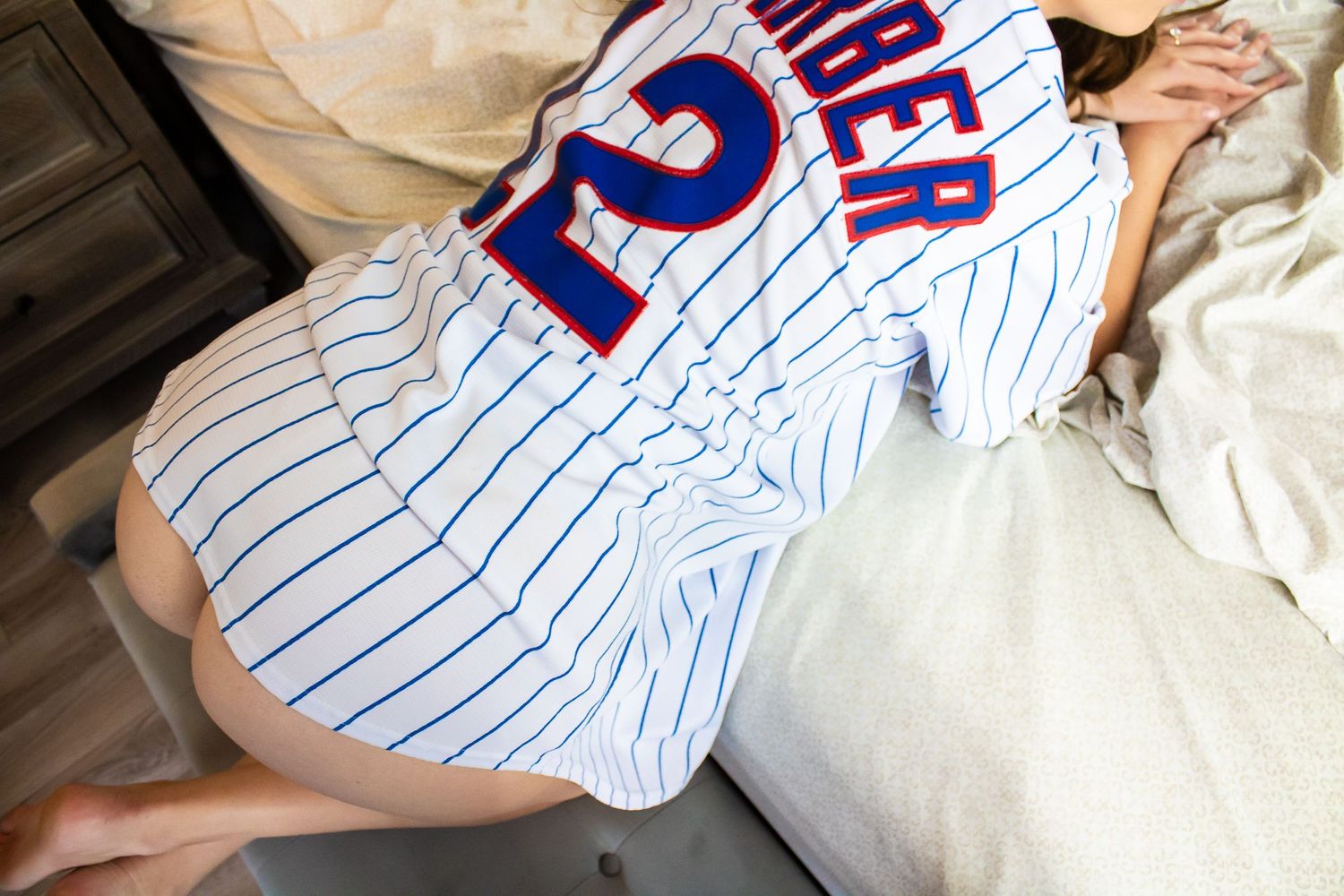 Chicago Cubs pinstripe baseball jersey displayed on bedding.