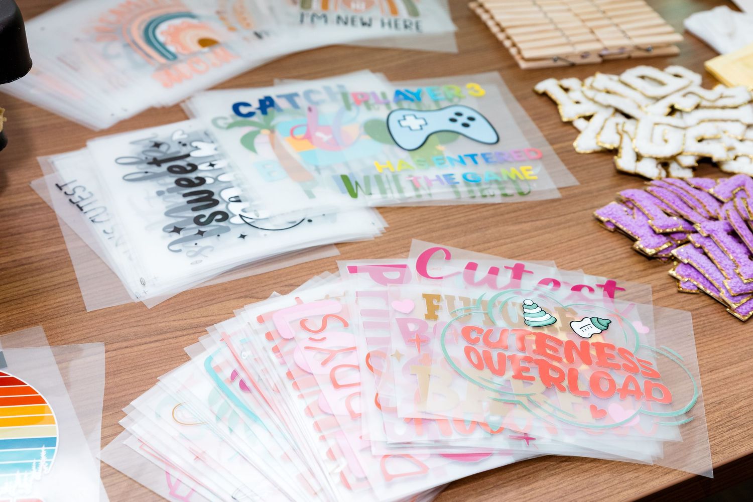 Collection of transparent plastic bags containing colorful craft materials and decorative elements.