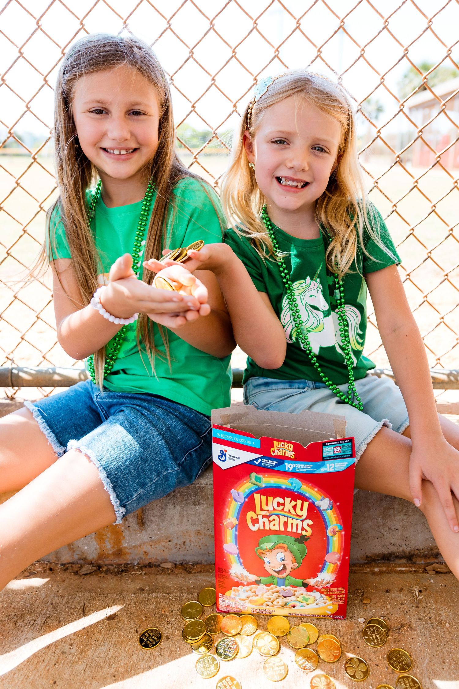 Children in matching green shirts with Lucky Charms cereal and gold coins.
