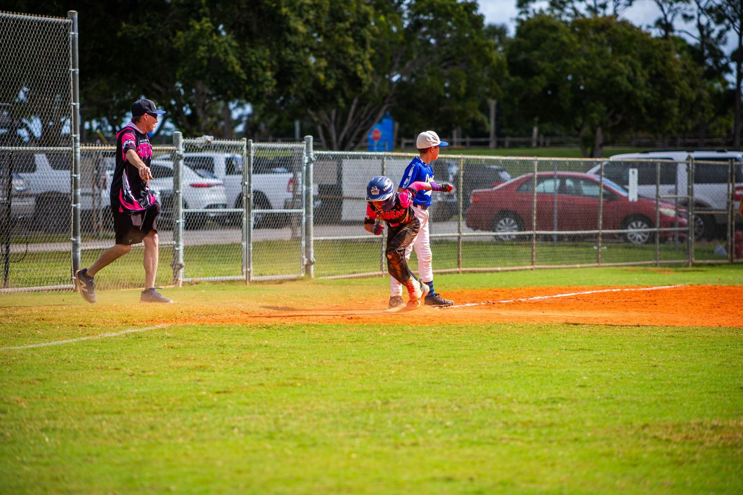 Baseball players compete in a game showing various plays and defensive positions across multiple field views.