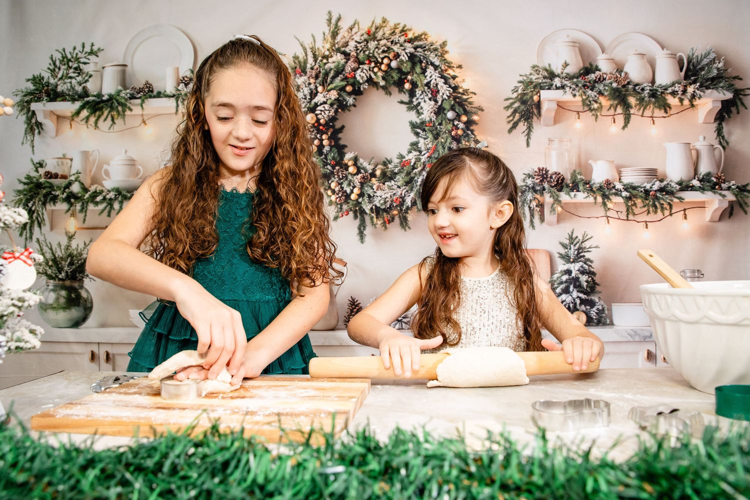 A series of festive holiday baking scenes with rolling dough and decorating cookies on a counter with evergreen decor.