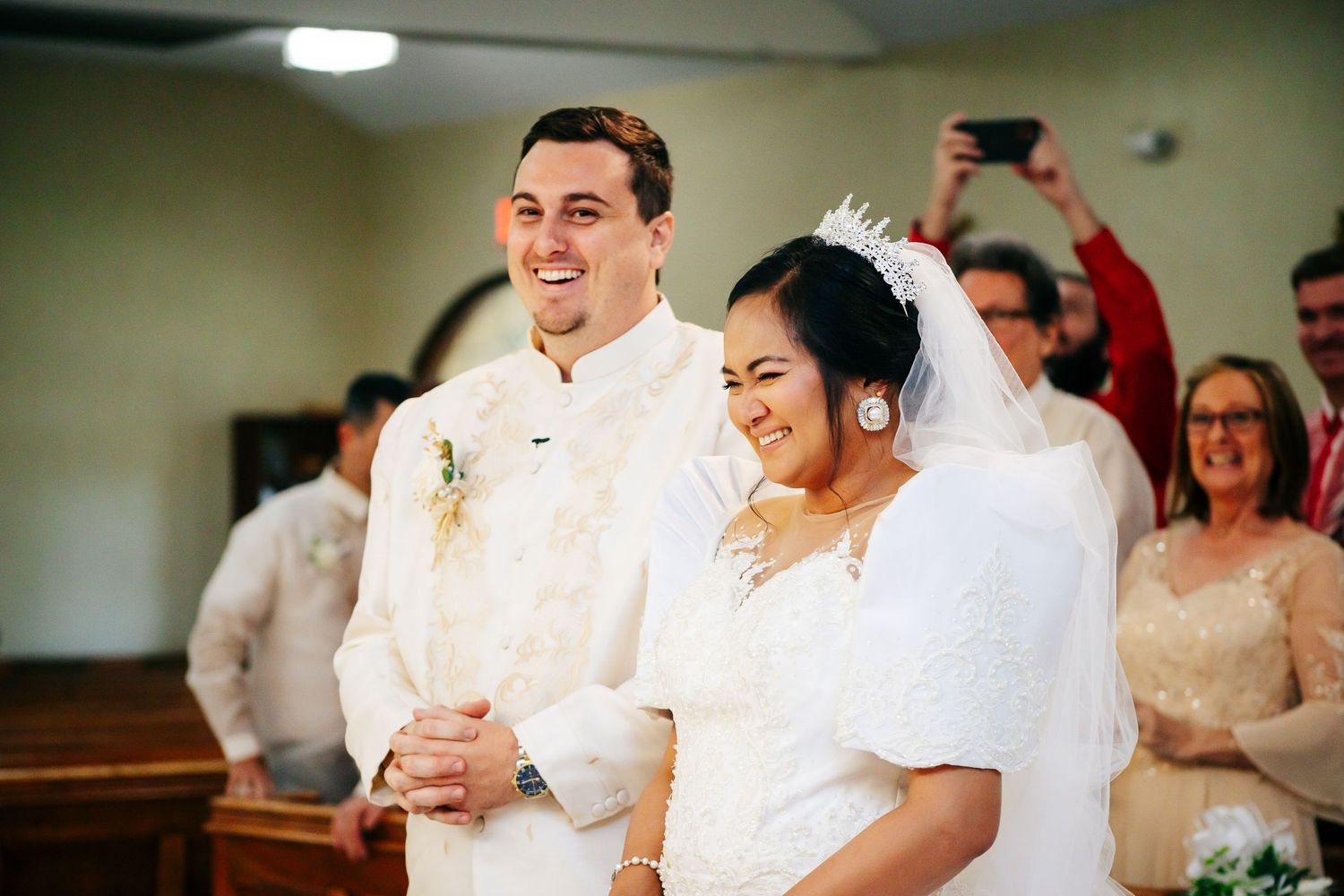 Happy newlyweds share a joyful moment during their church wedding ceremony.