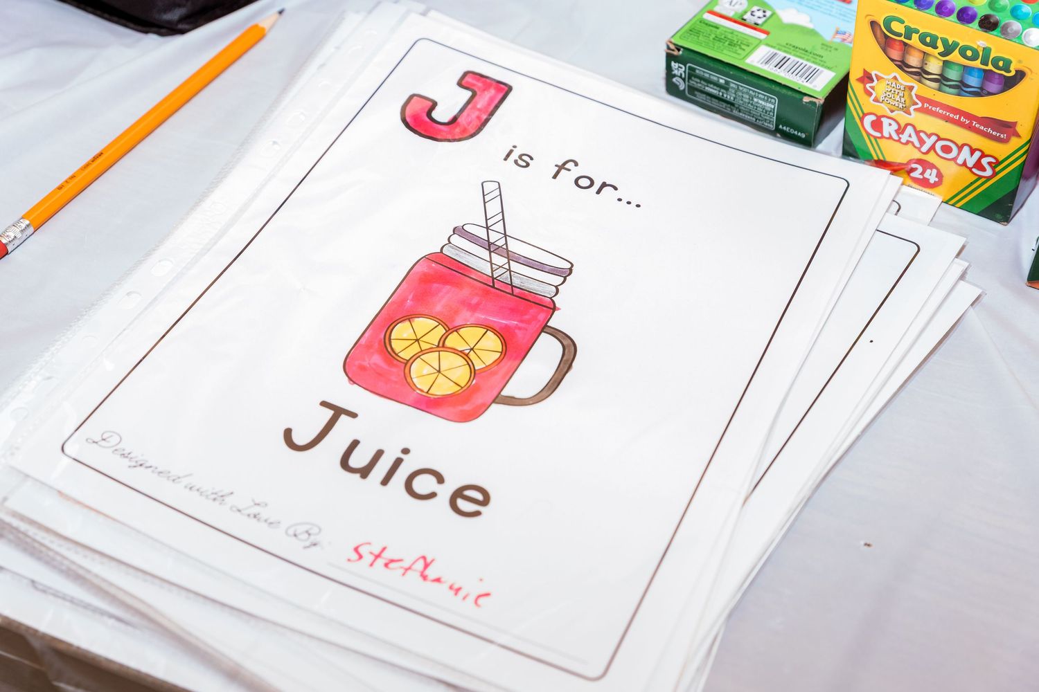 Educational materials and learning supplies spread out on a table surface.