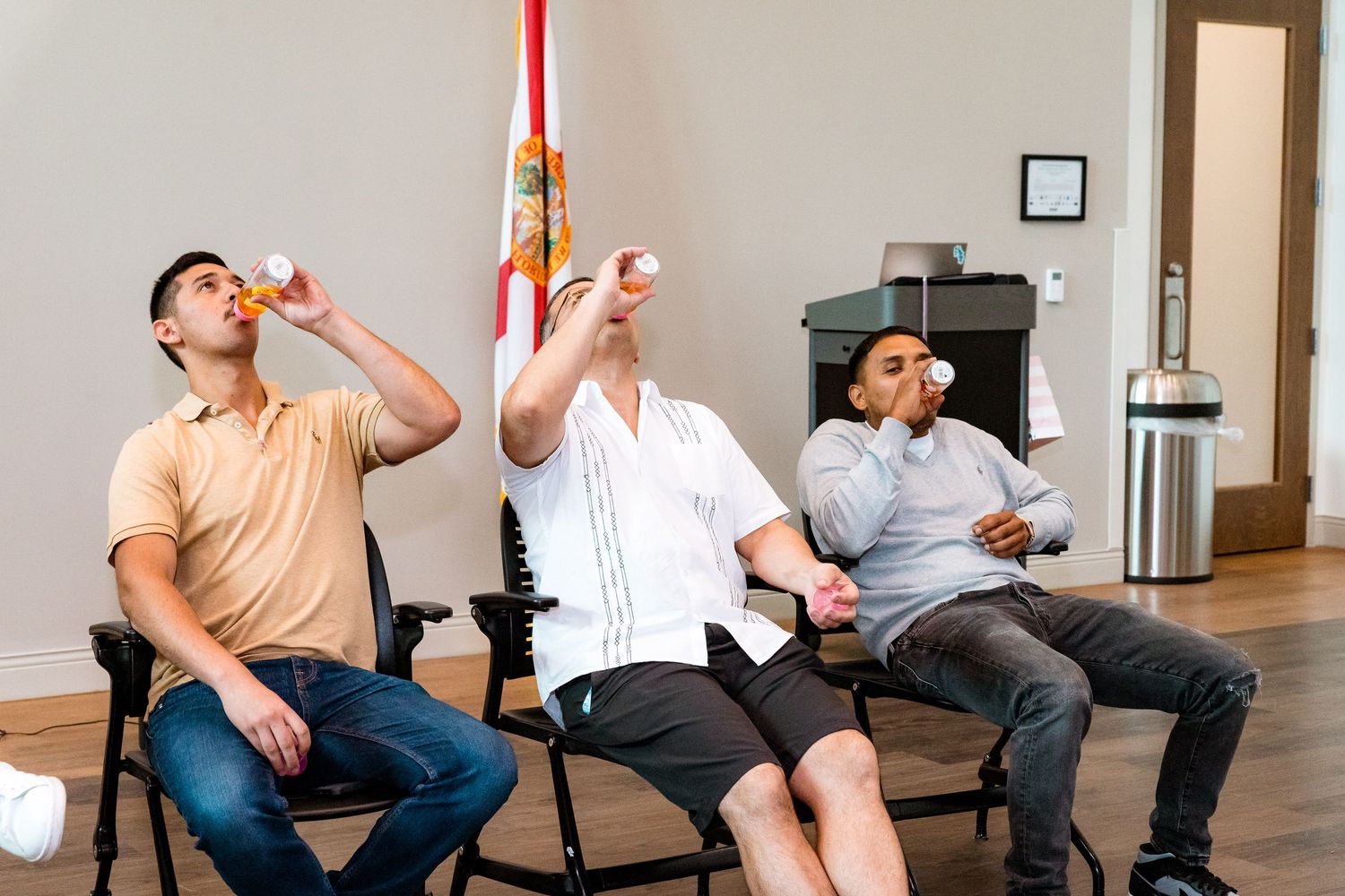 Event attendees sitting in chairs participating in a group activity.