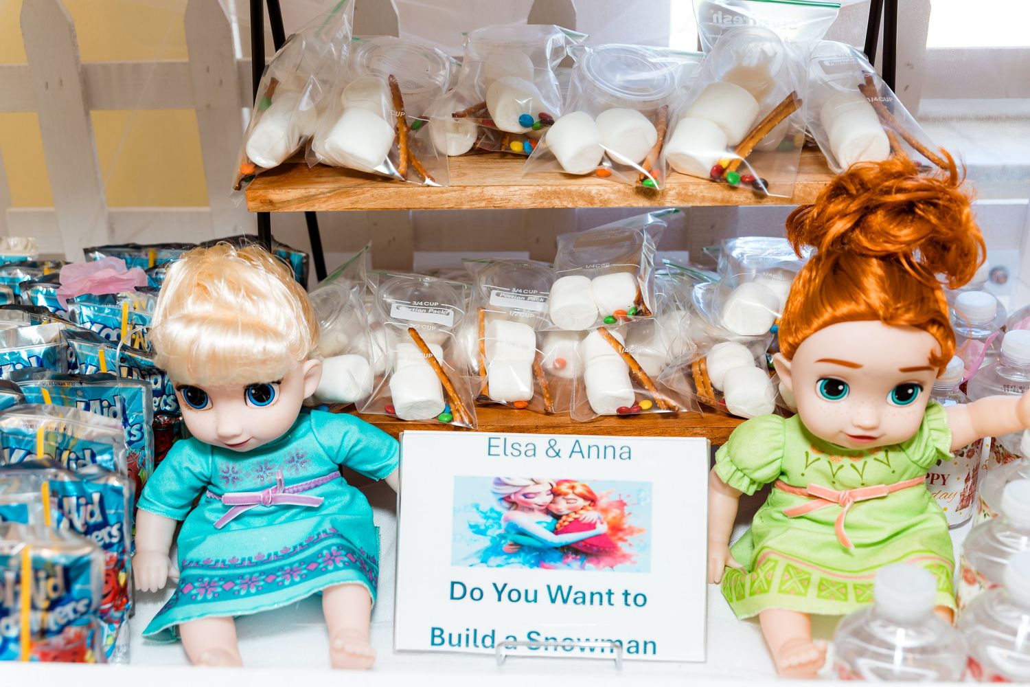 A shelf display of plush toys and themed party decorations with character signage.