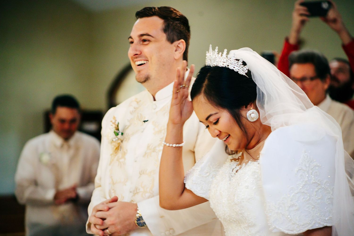 Couple participating in wedding ceremony inside church.