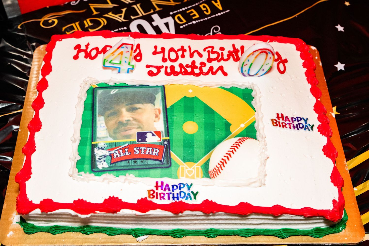 A birthday cake decorated with a baseball diamond and baseball-themed decorations.