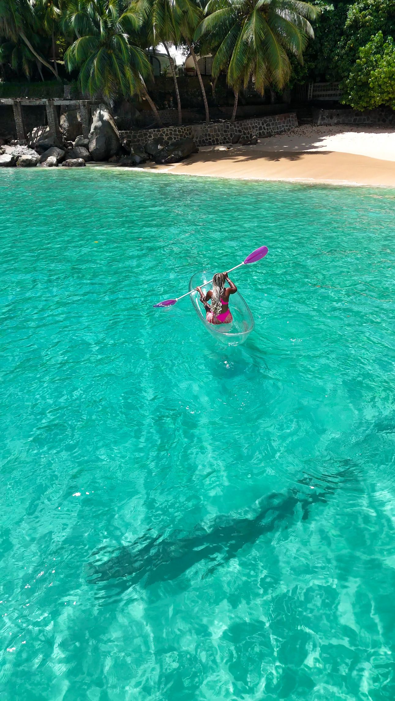 Crystal clear kayaking in turquoise sea.