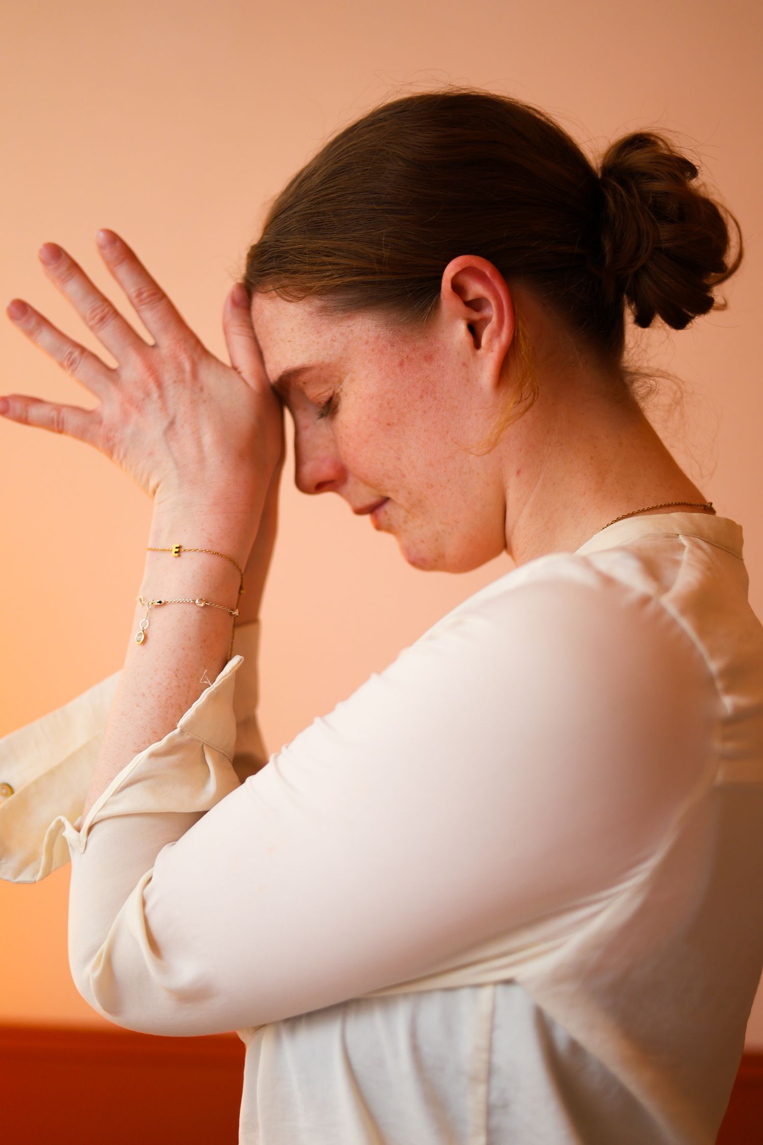 Series of images showing someone in a white sweater expressing frustration and distress against a peach-colored background.