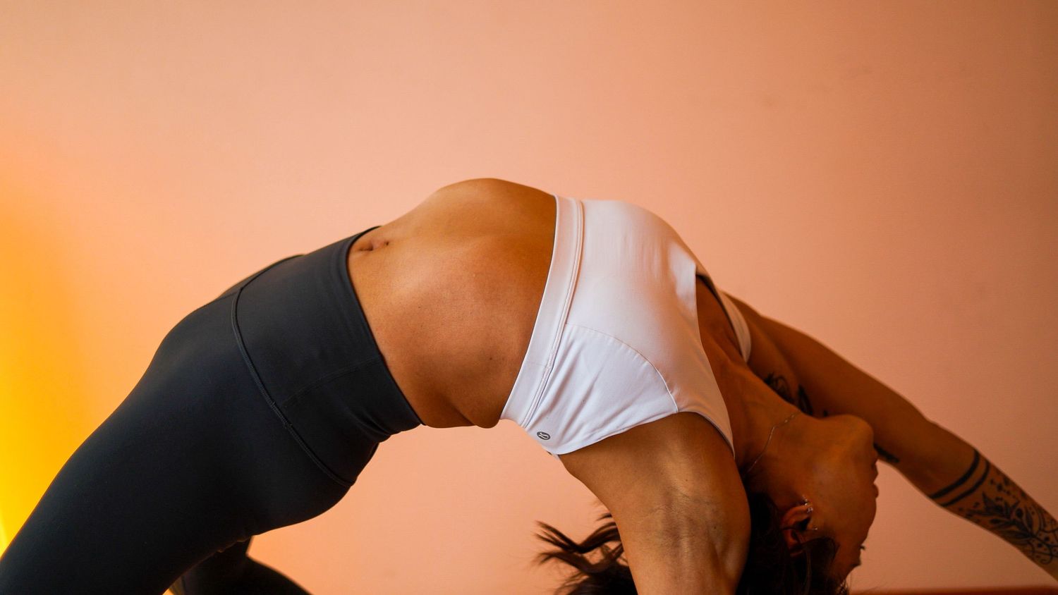 A series of six connected photos showing a person practicing yoga poses against an orange and black background.