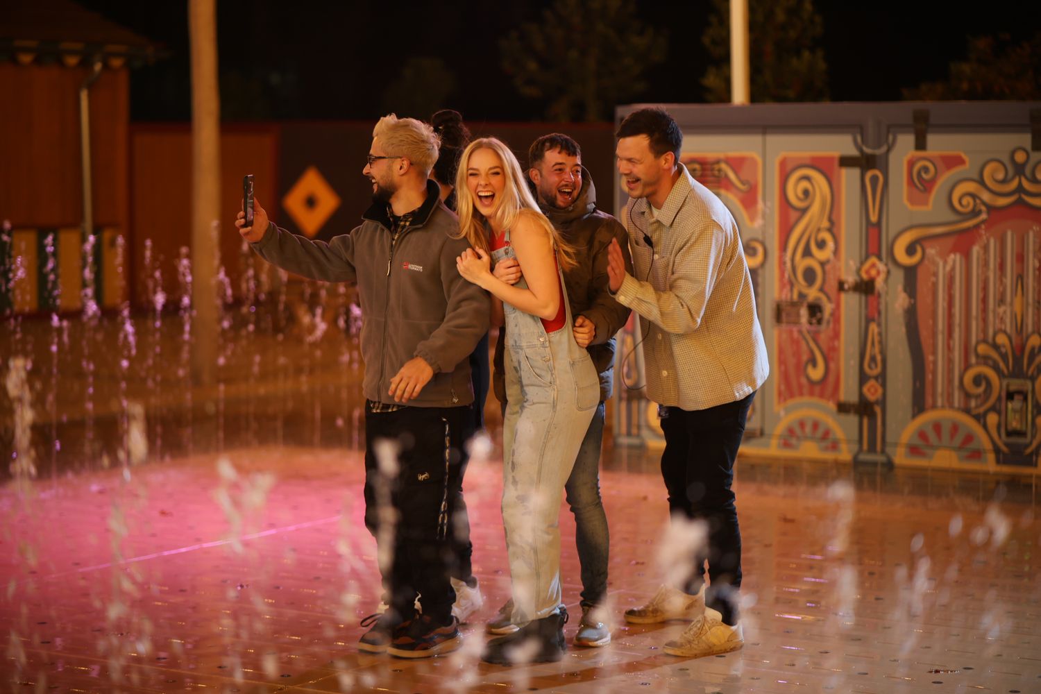 A group of people performing swing dance moves on a polished wooden dance floor during a social dance event.