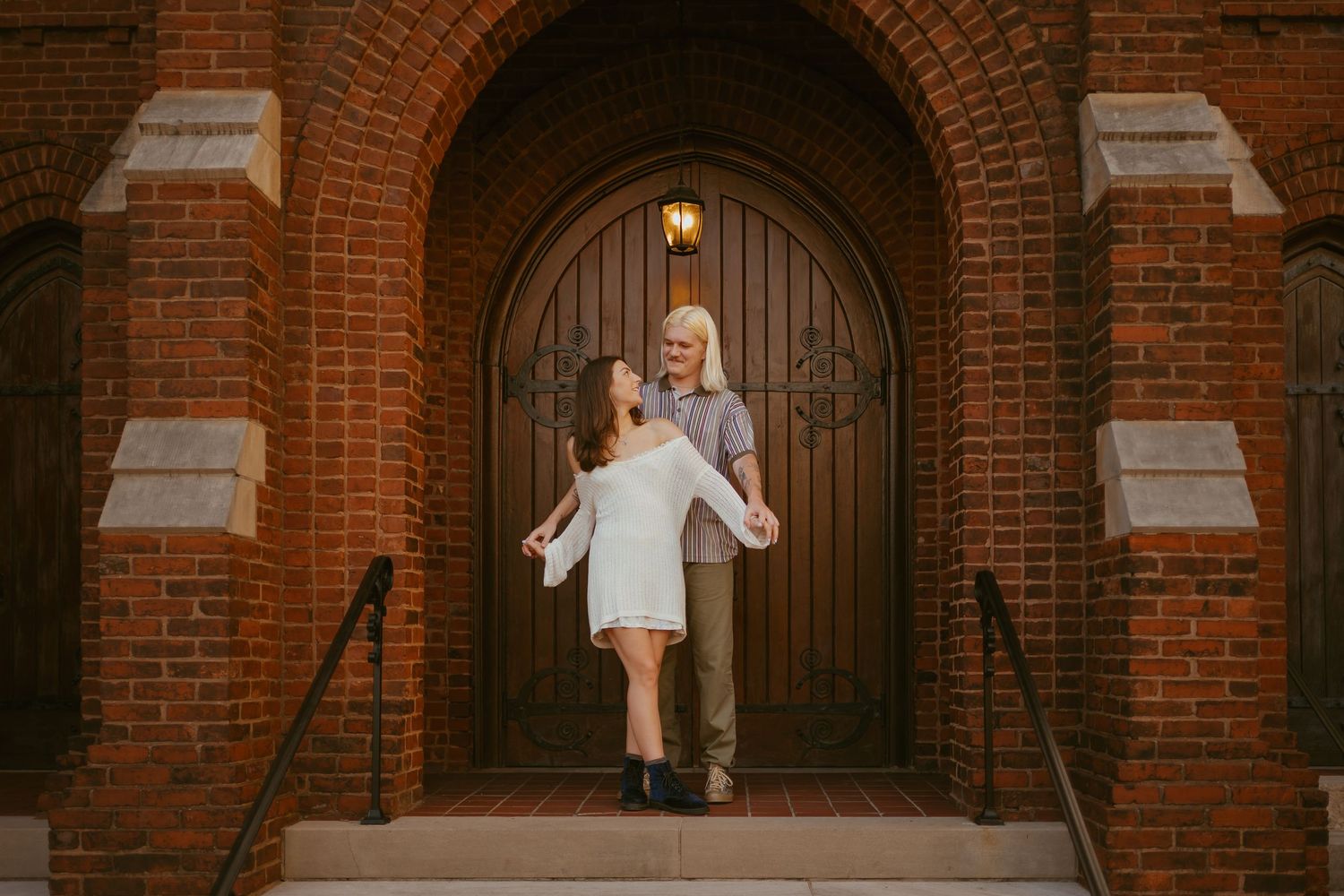 A series of four photos showing a toddler playing in front of a brick archway entrance.