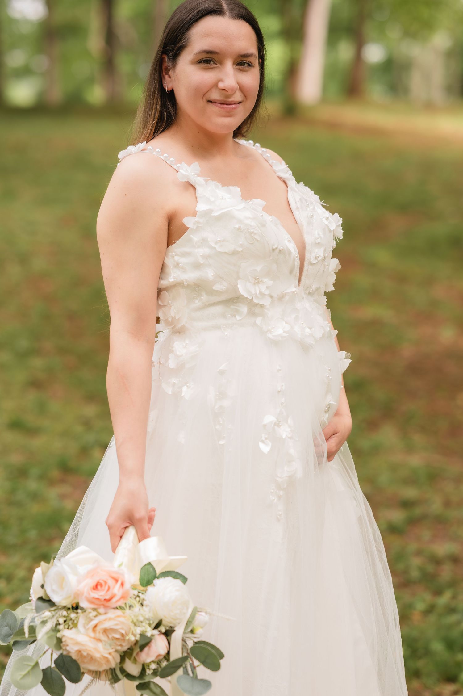 A white wedding dress with delicate lace details and floral embellishments shown from different angles with a peach rose bouquet.