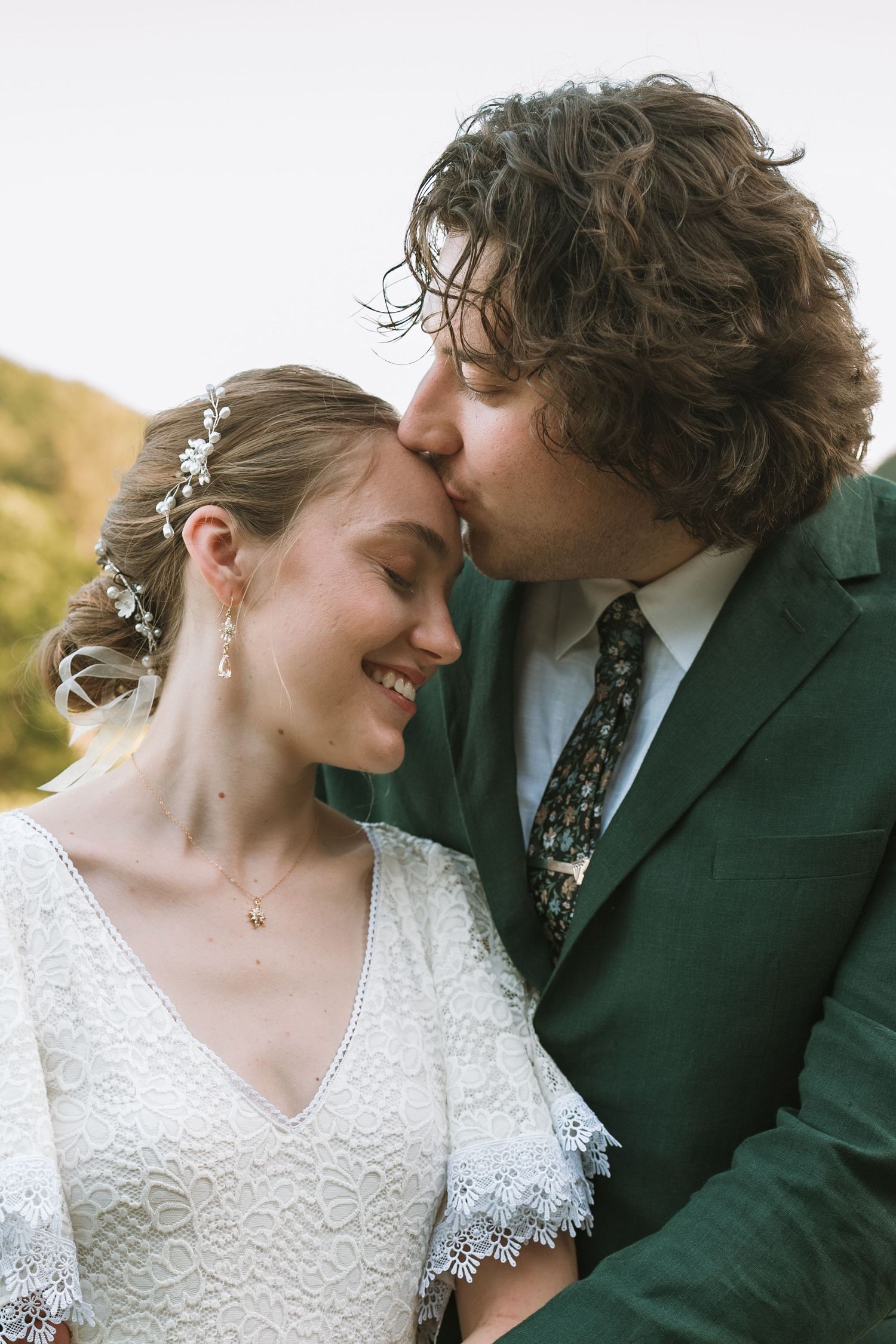 A romantic wedding couple shares intimate moments in a series of close-up shots showing their affection.