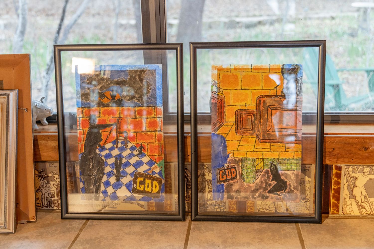 Artwork stacked against a window