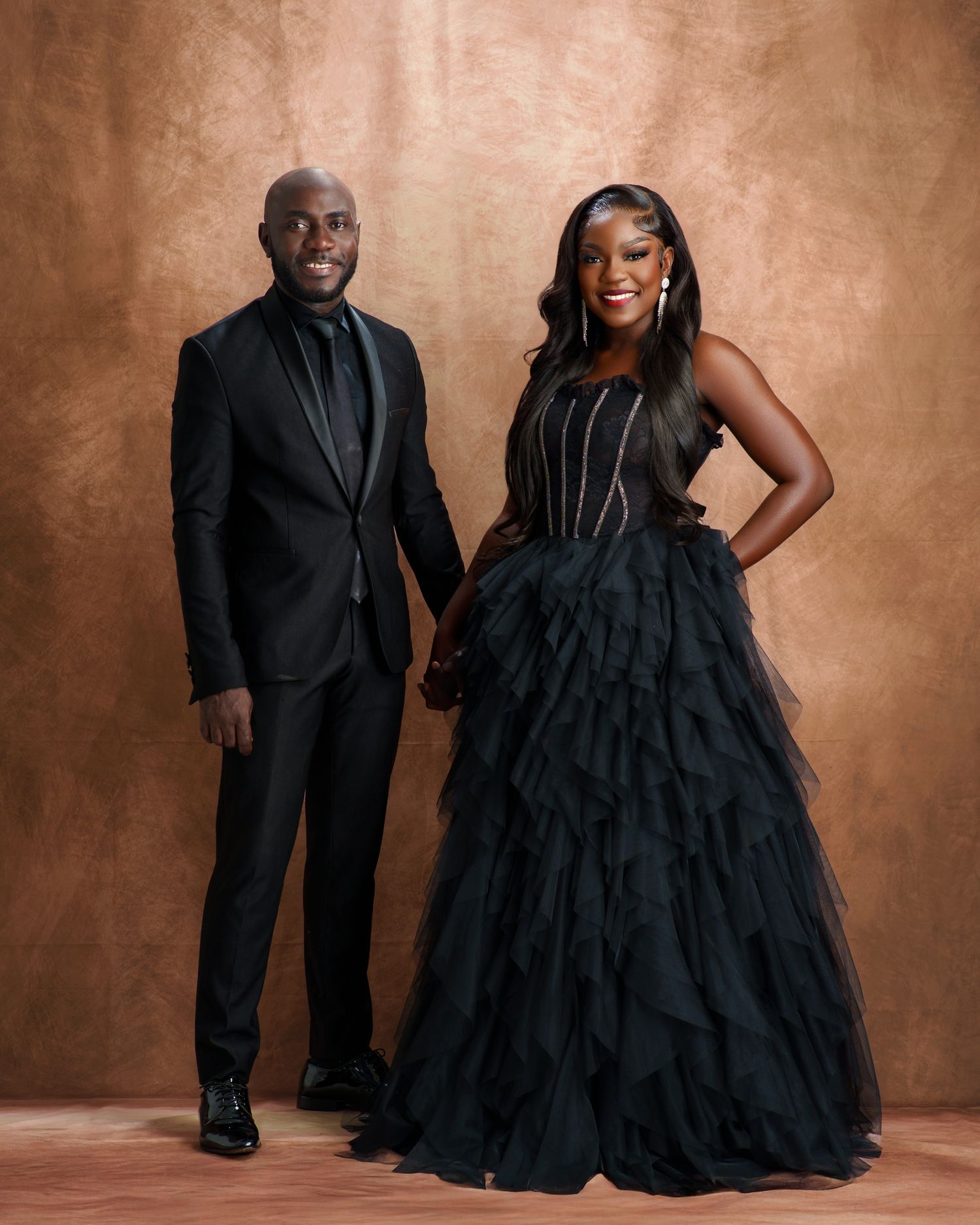 Formal portrait series featuring elegant black evening wear against textured brown background.