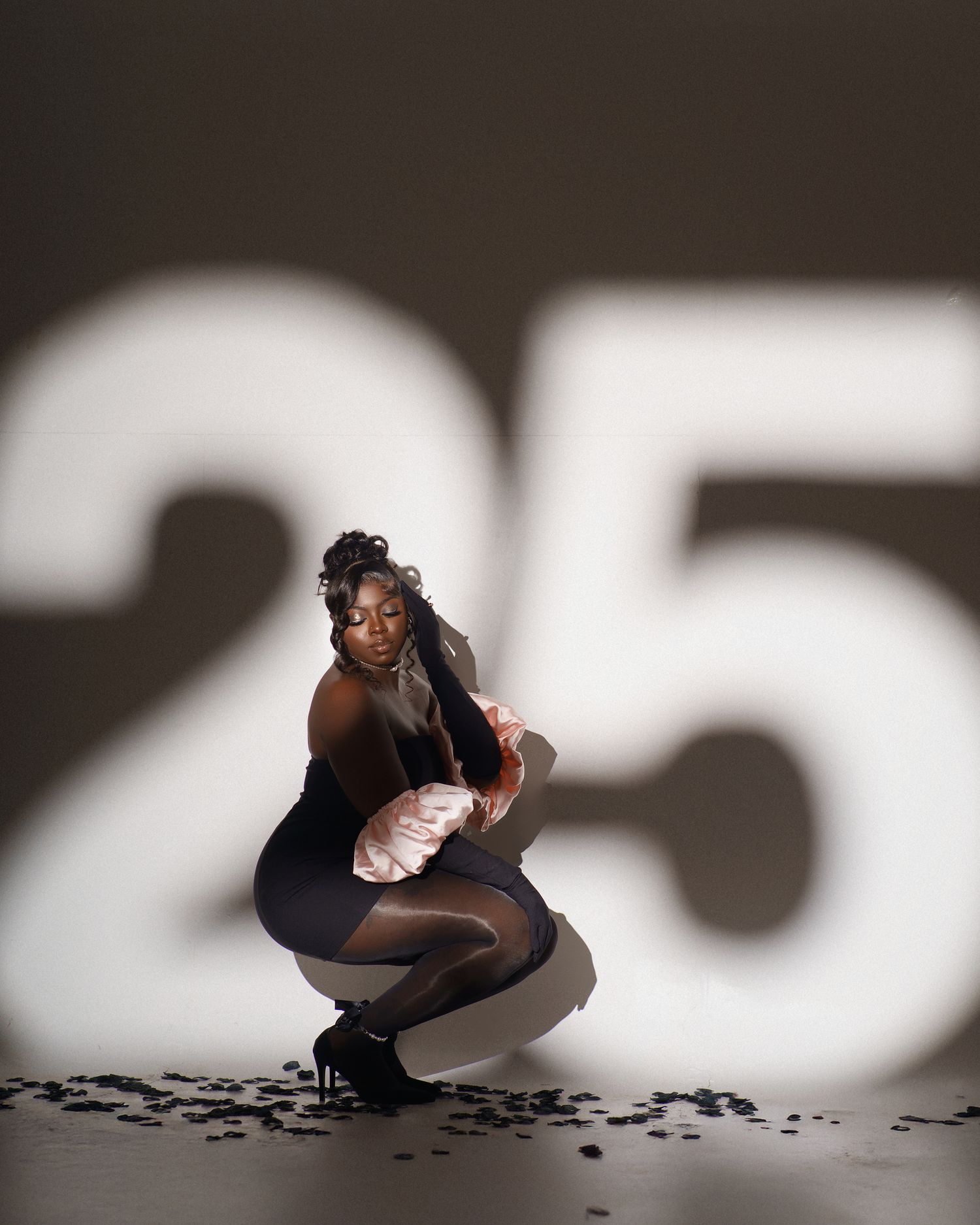 Creative shadow photography series on dark floor with geometric lighting.