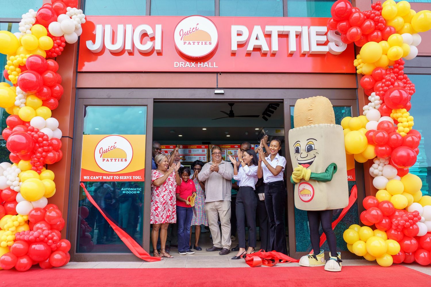 Grand opening of Juici Patties restaurant with ribbon cutting, Draxhall St Ann