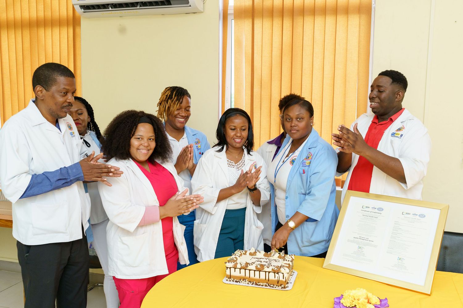 Healthcare workers from National Health Fund celebrating being ISO certified 2025