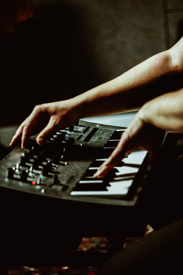 close-up on dynamic hands playing a piano keyboard in Berlin